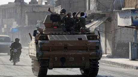 Turkish-backed forces &lsquo;CUT OFF US troops&rsquo; after seizing key highway in Syria