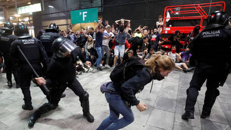 Protesters clash with police at the airport in Barcelona, Spain, on October 14, 2019.