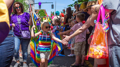A girl from the OHSU Pride Parade crew high fives spectators during the Portland Pride Parade and Festival on June 16, 2019, in Portland, OR © Getty Images / Diego Diaz / Icon Sportswire