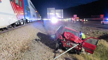 WATCH highway patrol trooper pull unconscious man from car SECONDS before train crash in Utah