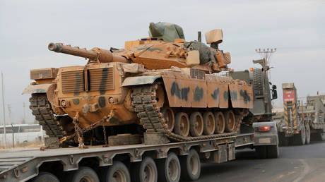 Turkish army vehicles and military personnel are seen near the Turkish-Syrian border on October 12, 2019.