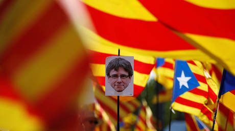 Puigdemont appears before Belgian authorities over extradition as Catalonia burns, general strike begins