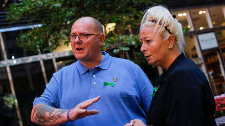 Charlotte Charles and Tim Dunn, parents of British teen Harry Dunn, speak during a interview in New York City, October 15, 2019.