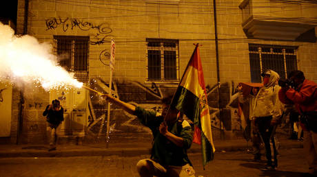 A demonstrator shoots a firework during a protest in La Paz, Bolivia, October 24, 2019.