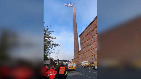 Stuck at nearly 30-story height: Emergency services scrambling to rescue man hanging UPSIDE DOWN (PHOTOS/VIDEOS)