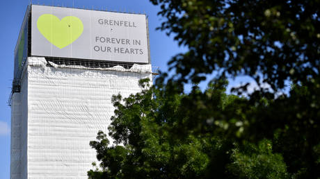 5db98a8a2030273c9c4fbde7 Tories jeer Corbyn’s green tie, forcing dismayed Theresa May to hiss… ‘it’s for Grenfell!’