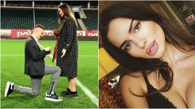 Pitch-perfect proposal: Footballer at Russian team pops the question in center circle at stadium (VIDEO/PHOTOS)