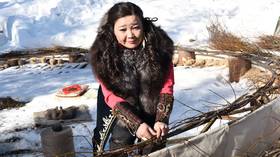 Russian shaman aims to capture REALLY BIG evil spirits (and a record) as she crafts dreamcatcher the size of Soviet block (VIDEO)