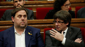 Former Catalan Vice President Oriol Junqueras (left) and President Carles Puigdemont (right), FILE PHOTO. © Reuters/Albert Gea