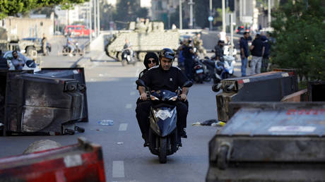 Protesters block roads in Lebanon on Monday, paralyzing traffic in the capital and on major highways