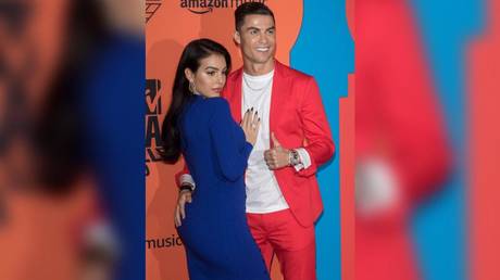 Cheeky! Cristiano Ronaldo gives girlfriend Georgina Rodriguez pat on the backside as pair wow fans at MTV Awards (PHOTOS)