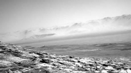 What a butte! Curiosity beams back hauntingly beautiful PHOTOS of barren Martian wasteland