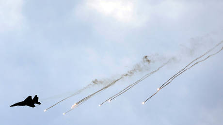 FILE PHOTO: An Israeli Air Force F-15 fighter jet releases flares during an aerial demonstration at the Hatzerim air base in southern Israel.
