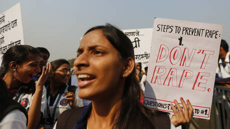 FILE PHOTO Students from various colleges holding placards as they shout slogans during rally against gender discrimination and violence towards women in Mumbai © REUTERS/Shailesh Andrade