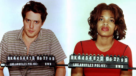 Hugh Grant tweets own infamous LA mugshot as British actor faces down trolls angry at his anti-Tory election campaigning