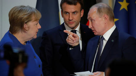 Russia's President Vladimir Putin gestures at German Chancellor Angela Merkel after a Normandy-format summit in Paris, France December 10, 2019.