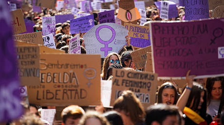 People take part in a protest during a nationwide feminist strike on International Women's Day in Madrid © REUTERS/Juan Medina