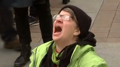 A woman screams at the heavens during the inauguration of President Donald Trump, © YouTube / On Demand News