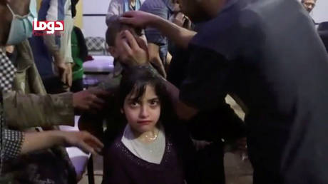 A girl looks on following alleged chemical weapons attack, in what is said to be Douma, Syria in this still image from video obtained by Reuters on April 8, 2018. © Reuters / White Helmets / Reuters TV