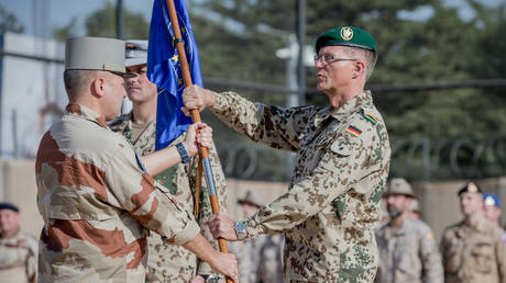 FILE PHOTO: Peter Mirow, Bundeswehr General, receives the troop flag of the EU training mission EUTM MLI from the French General Daniel Grammatico, in Bamako, Mali, on November 12, 2018.