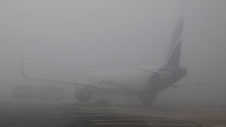 Flights diverted, trains delayed: New Delhi sinks in dense fog as India shivers from severe cold wave (PHOTOS, VIDEOS)