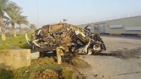 A damaged car, claimed to belong to Qassem Soleimani and Abu Mahdi al Muhandis, is seen near Baghdad International Airport, Iraq, on January 3, 2020.