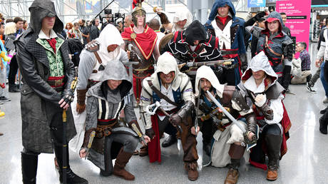 Cosplayers dress as characters from the Assassin's Creed video game. ©Craig Barritt / GETTY IMAGES via AFP