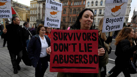 Protestors supporting a British woman found guilty of lying in a rape case in Cyprus, take part in a march in London