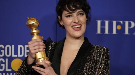 Fleabag writer and star Phoebe Waller-Bridge poses backstage with her Golden Globe award.