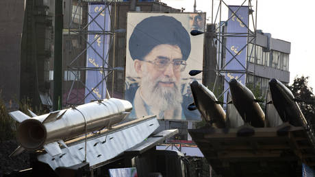 FILE PHOTO: Iranian-made Fateh-110 and Persian Gulf missiles are seen next to portrait of Iran's Supreme Leader Ayatollah Khamenei in Tehran.