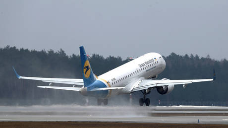 FILE PHOTO: A Ukraine International Airlines flight takes off at Riga International Airport, in Riga, Latvia.
