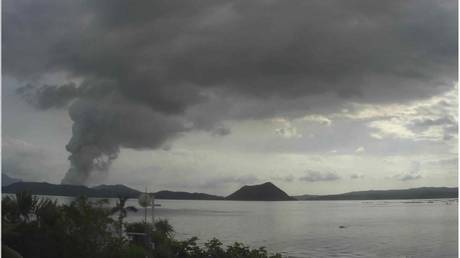WATCH Taal volcano in the Philippines releasing massive plume of steam & ash during first eruption in decades