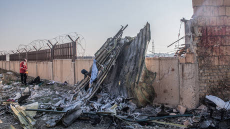 FILE PHOTO: Rescuers at the Ukrainian plane crash site near Tehran