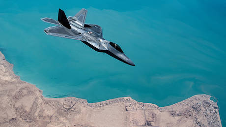 A U.S. F-22 Raptor, based out of Al Udeid Base in Doha, Qatar, receives fuel from a 28th Expeditionary Air Refuelling Squadron KC-135 Stratotanker during a combat air patrol mission over an undisclosed location in Southwest Asia © Reuters / U.S. Air Force / Handout / Russ Scalf