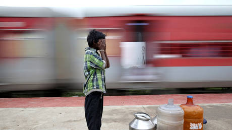 Dozens injured in India as passenger & cargo trains COLLIDE due to thick fog (PHOTOS)