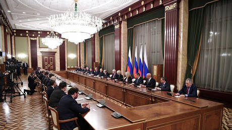 Russian President Vladimir Putin and Prime Minister Mikhail Mishustin meet with members of the new government in Moscow, Russia January 21, 2020.