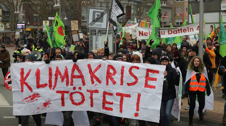 Environmental organizations protest against the commissioning of the North Rhine Westphalian power plant in Germany, January 24, 2020. The placard reads "The climate crisis is killing!"