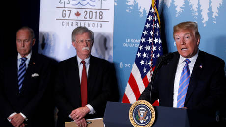 Donald Trump with John Bolton at G7 summit in the Charlevoix city of La Malbaie.