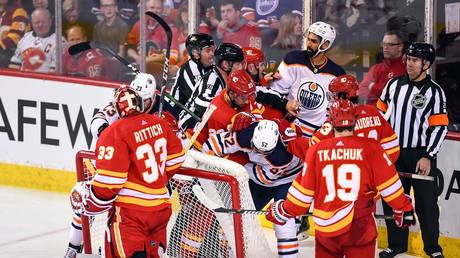 Goalie fight! Rare sight as goaltenders slug it out after ‘Battle of Alberta’ NHL clash erupts into mass brawl (VIDEO)