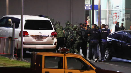 Thai security forces move to enter the Terminal 21 shopping mall following a gun battle, to try to stop a soldier on a rampage after a mass shooting, Nakhon Ratchasima, Thailand February 9, 2020.