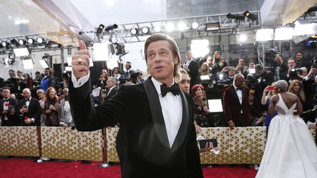 Oscars take less than 20 minutes to go political as Best Supporting Actor Brad Pitt gives cringe shoutout to John Bolton