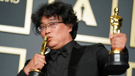 Bong Joon-ho, winner of the Original Screenplay, International Feature Film, Directing, and Best Picture award for “Parasite,” poses in the press room during the 92nd Annual Academy Awards at Hollywood and Highland on February 09, 2020 in Hollywood, California