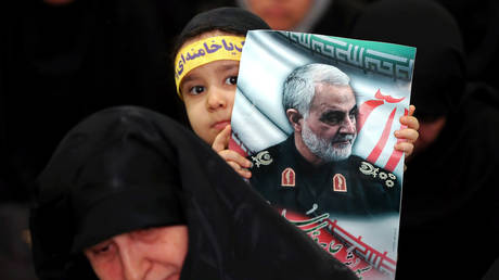 FILE PHOTO: People gather in Tehran to mourn during a forty-day memorial for Iranian Quds Force commander Qassem Soleimani, who was killed in a US air strike in January.