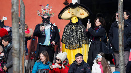 People wearing masks during the Carnival in Venice, Italy, February 9, 2020.