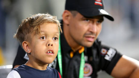 FILE PHOTO Quaden Bayles looks on with Cody Walker of the Indigenous All-Stars before the NRL match at Cbus Super Stadium on February 22, 2020 © Getty Images / Jason McCawley