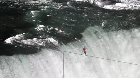 Tightrope walker Nik Wallenda walks the high wire over the Horseshoe Falls in Niagara Falls