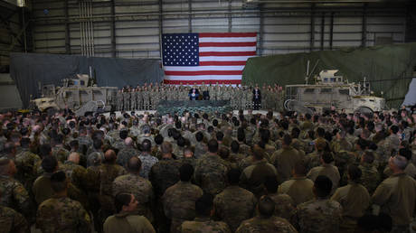 Afghan’s President Ashraf Ghani and US President Donald Trump address US soldiers at Bagram Air Field in Afghanistan. November 2019. © Olivier Douliery / AFP