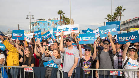 FILE PHOTO: Supporters cheer as Senator Bernie Sanders speaks during a campaign rally at Venice Beach in Los Angeles, California, US, on December 21, 2019.