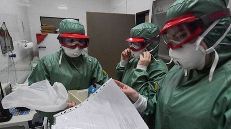 FILE PHOTO Employees of sanitary and epidemiological control in the infirmary of terminal F of Sheremetyevo airport.