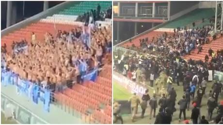 Culture clash: Shocking scenes as football fans in Grozny charge at shirtless Zenit supporters over ‘insult to local customs’